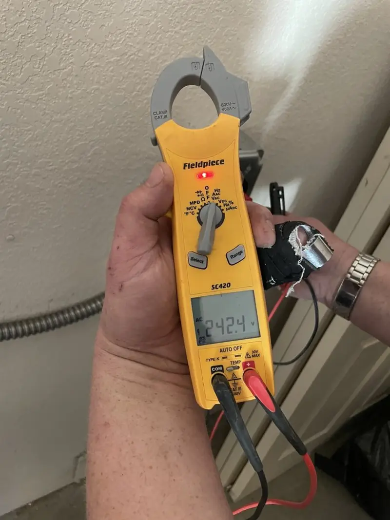 Voltage testing with clamp meter during Aluminum Wiring Replacement in Chesaning